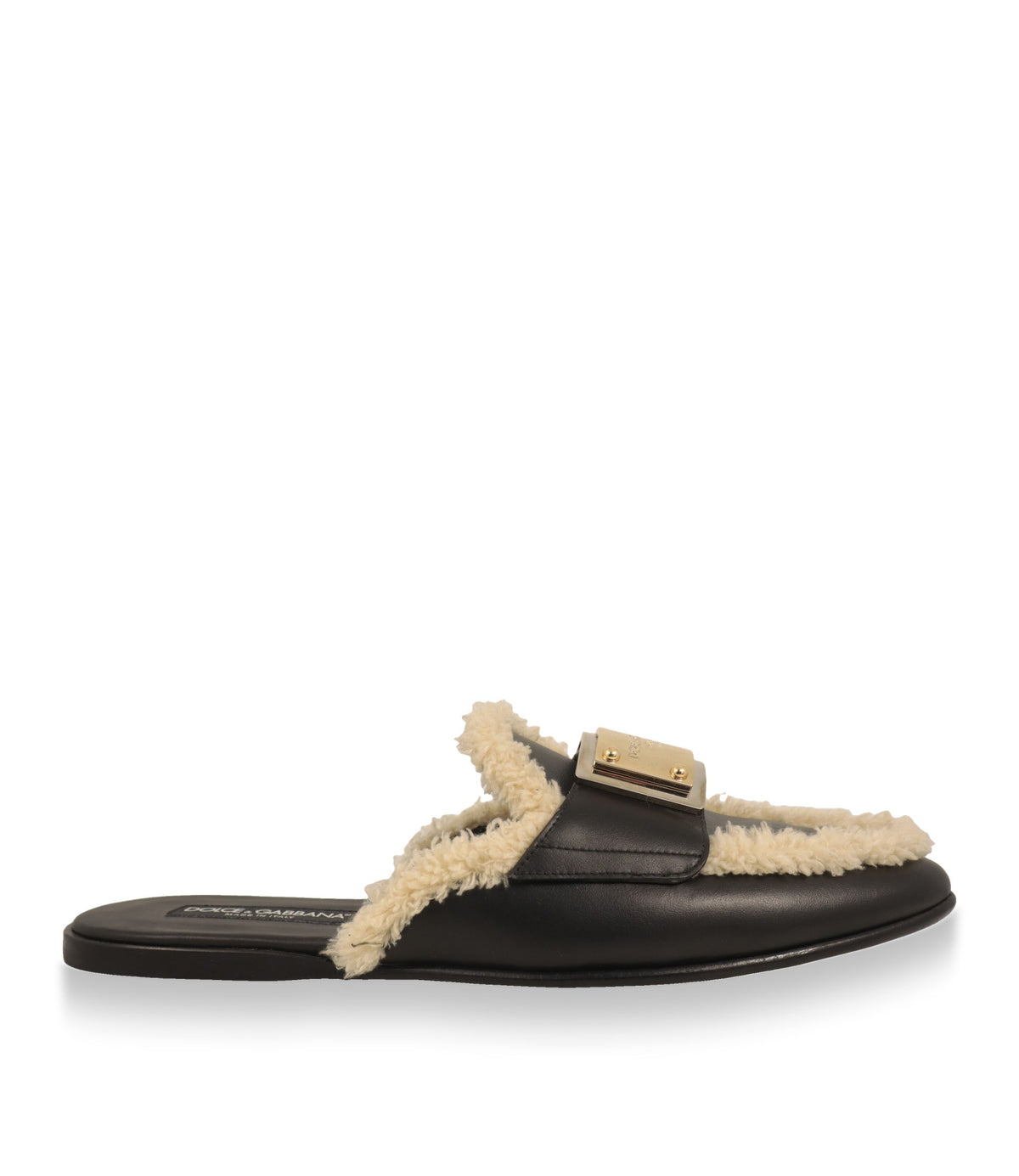 Dolce & Gabbana Slipper aus schwarzem Kalbsleder mit cremefarbener Fellkante in der Seitenansicht