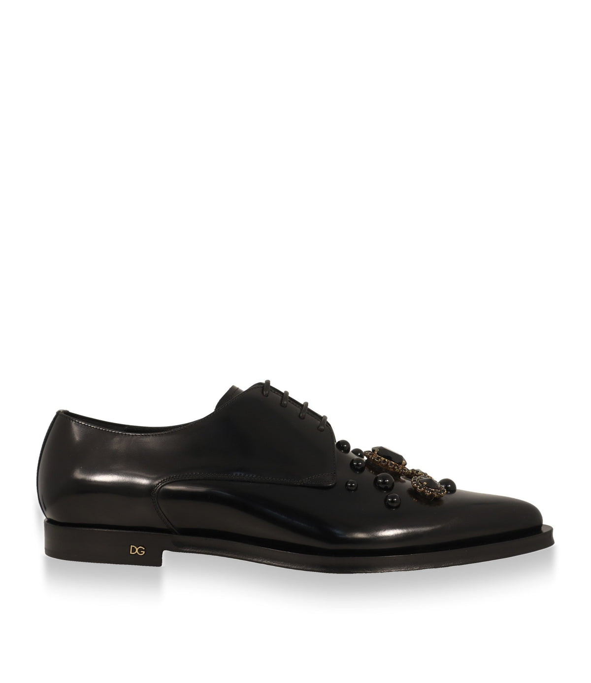 Dolce & Gabbana Derby Schuhe aus schwarzem Leder in der Seitenansicht mit goldfarbenem DG-Emblem
