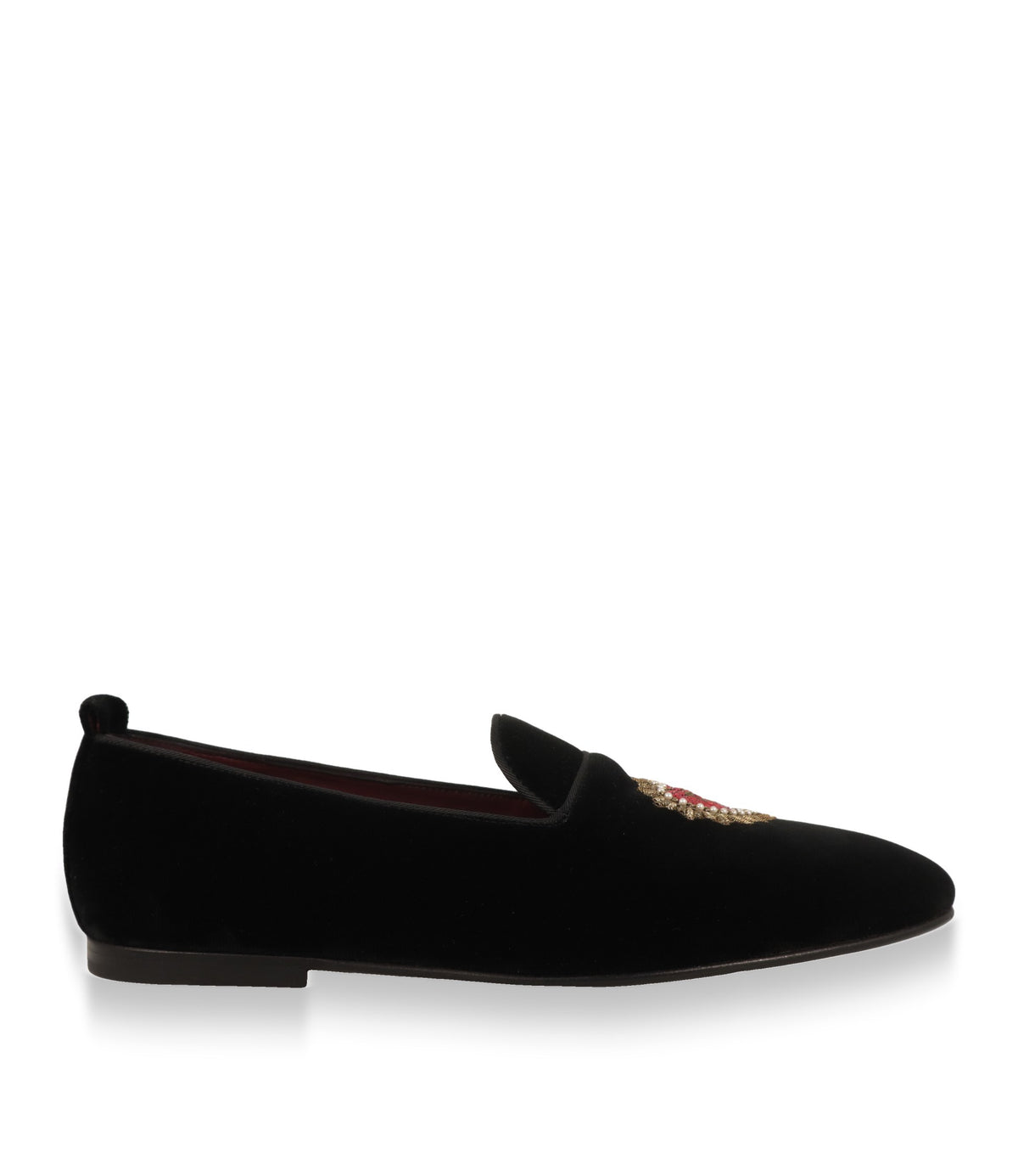 Dolce & Gabbana Slipper aus schwarzem Samt in der Seitenansicht mit flacher Ledersohle