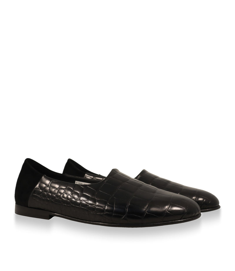Schwarze Dolce & Gabbana Slipper aus Leder – Paar in Schrägansicht