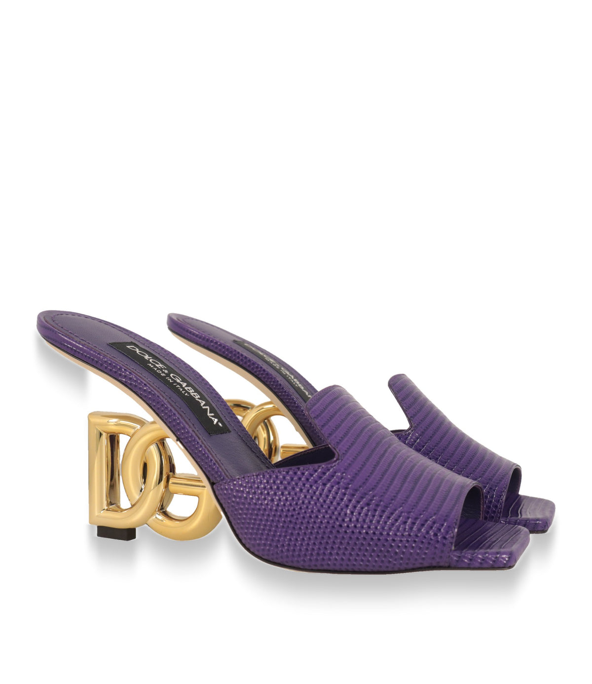 Dolce & Gabbana Mules aus lilafarbenem Leder mit Iguana-Prägung, Paaransicht schräg