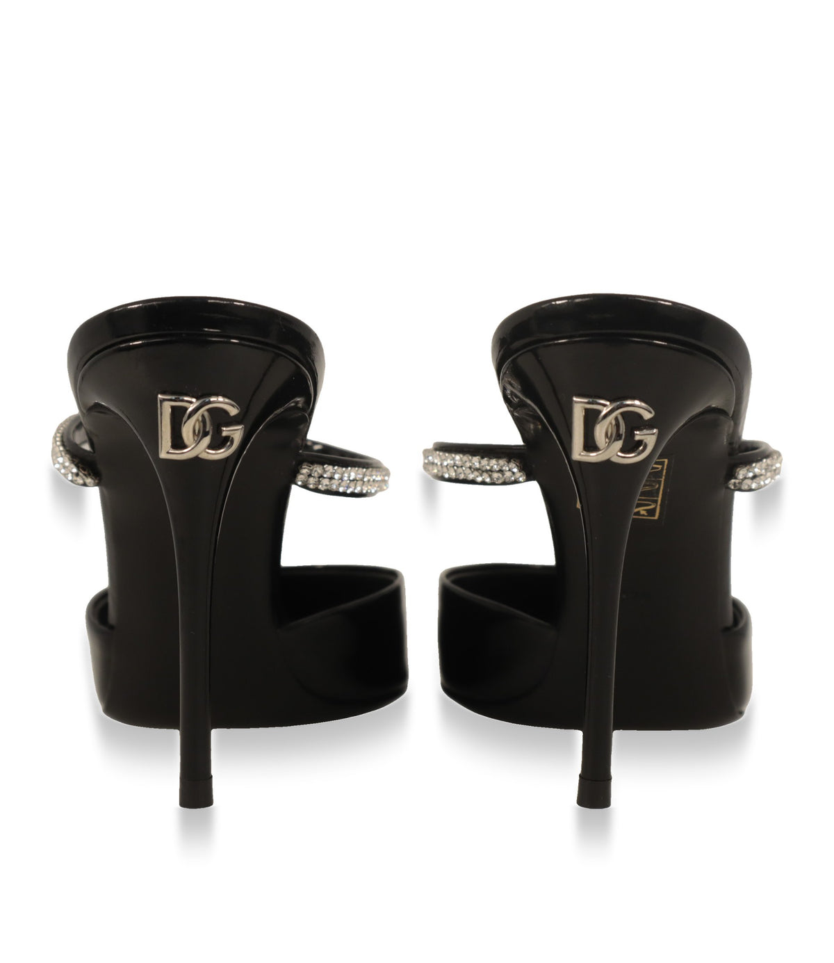 Rückansicht der Dolce & Gabbana Mules mit silberfarbenem DG-Logo am Absatz