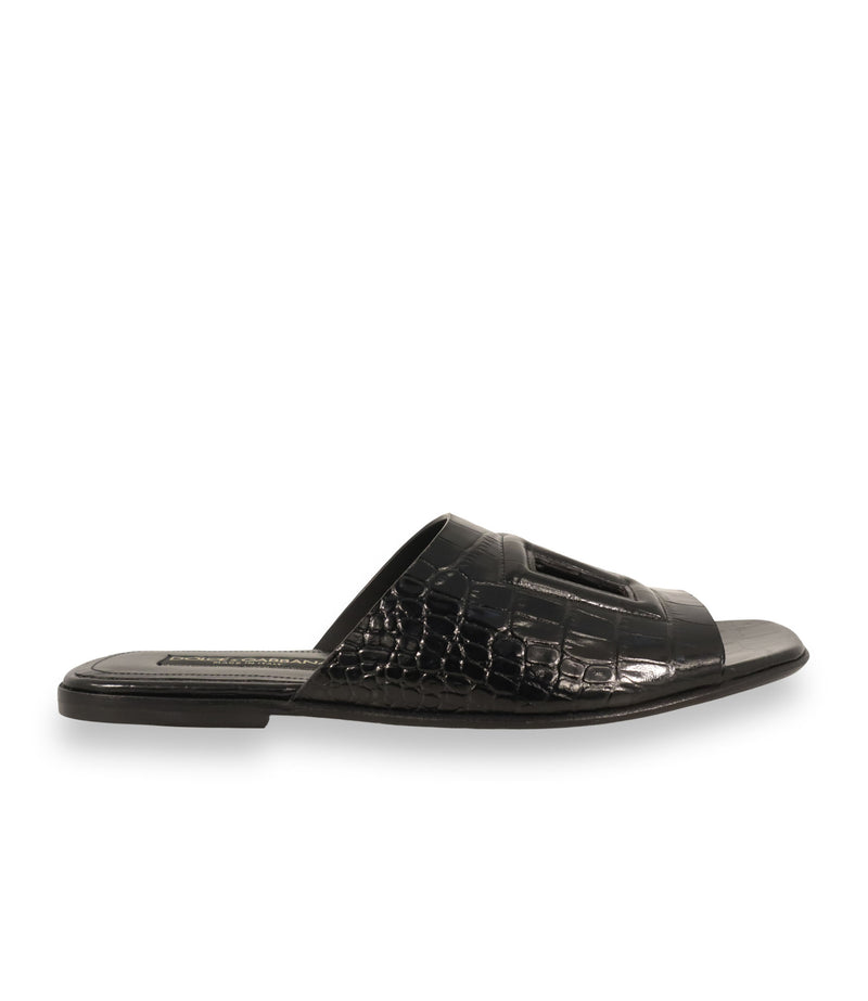 Dolce & Gabbana Pantoletten Größe 39 in Schwarz mit Kroko-Prägung und Logo-Applikation aus Leder.