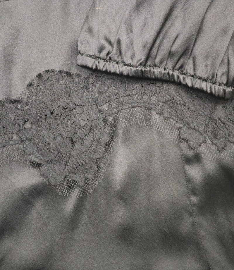 Dolce & Gabbana schwarze Bluse Größe 42 mit Spitze am Ausschnitt und Saum, Puffärmel elegant