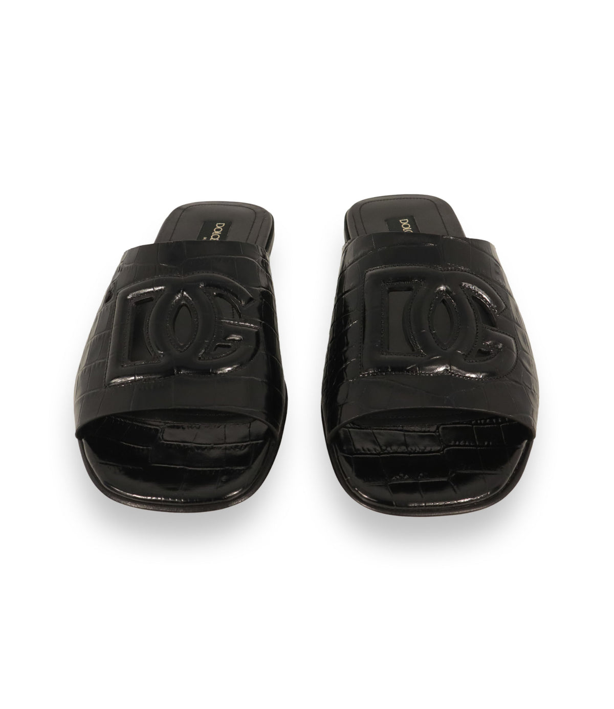 Dolce & Gabbana Pantoletten Größe 39 in Schwarz mit Kroko-Prägung und Logo-Applikation aus Leder.